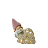 Figurine de Noël Fillette à bonnet rose sur Coeur LED